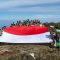 Tim Ekspedisi Hari Bhayangkara Bentangkan Bendera Merah Putih